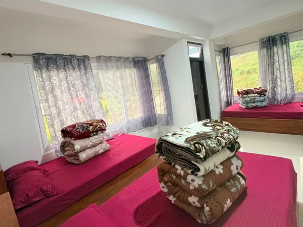 New room with two double beds and large windows