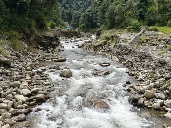 The Gorkhey Khola running over boulders below the village