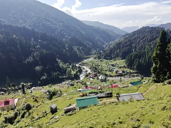 The Gorkhey valley seen from above, with houses and forested slopes